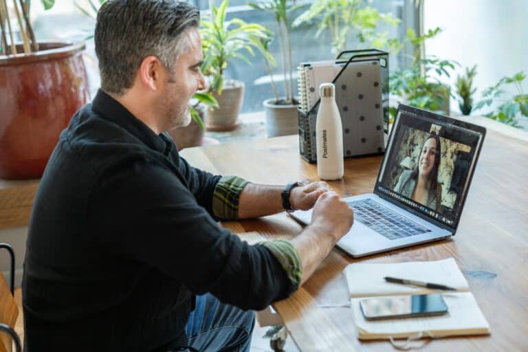 two person remote meeting from office space via laptop Your People Partners two person remote meeting from office space via laptop